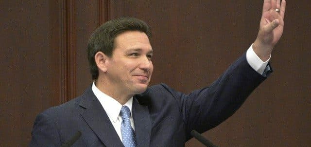Crowd Shouts Four More Years At DeSantis Presser